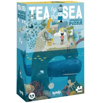 Embalaža sestavljanke "Tea by the Sea" znamke Londji – 100-delna sestavljanka s čarobno ilustracijo obmorske hiše in podvodnega sveta.